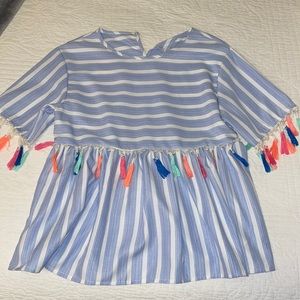 Blue and white striped top with colorful poms